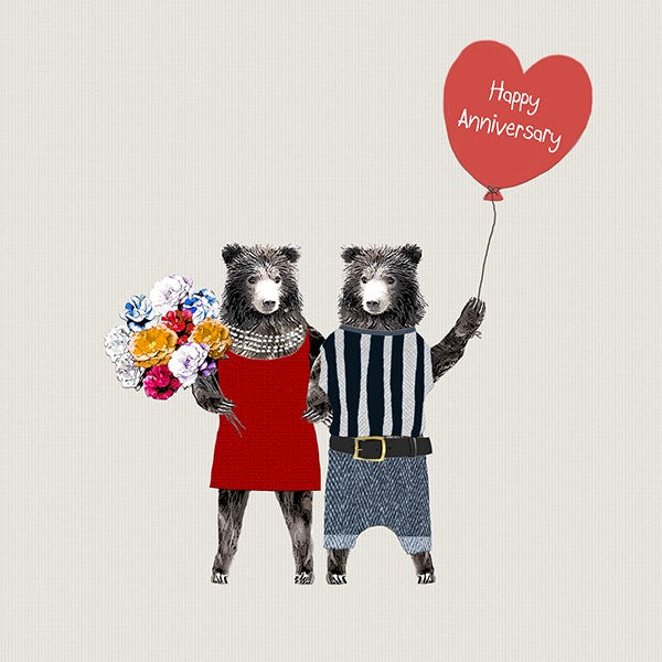 One female bear wearing a dress and pearls, holding a bunch of flowers linking arms with a male bear holding a heart shaped balloon.