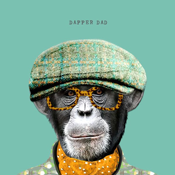 Chimp dressed on a flat cap, scarf and glasses.