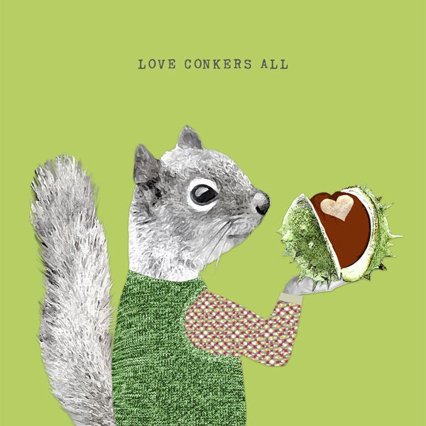Squirrel holding a heart shaped conker.