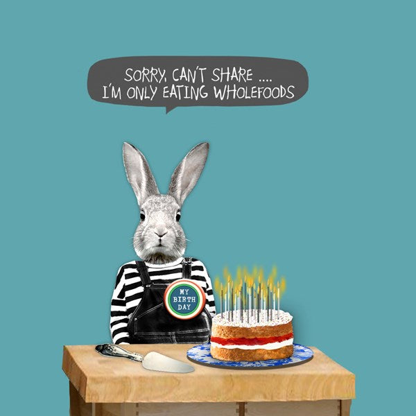 Bunny wearing a birthday badge with a birthday cake and candles.