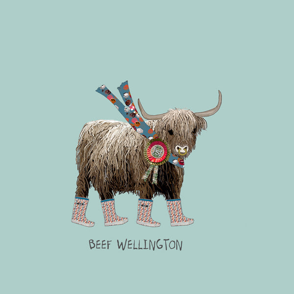 Prize cow wearing wellington boots.