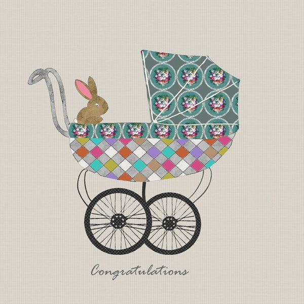Colourful pram with a bunny.