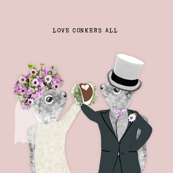 Squirrel bride and groom holding a conker with a heart shape.
