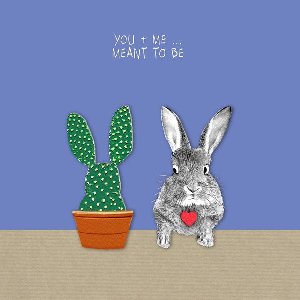 A cute bunny holding a heart next to a bunny shaped cactus.