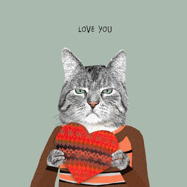 A cat wearing a striped jumper holding a giant knitted heart.
